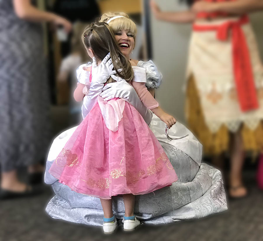 Cinderella hugging a child